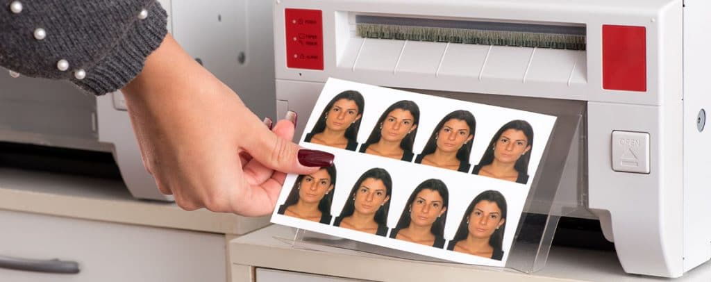 just-printed-passport-photos-exiting-a-printer